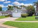 Well-manicured lawn and landscaped garden beds accentuate this single-Gathering home, creating a welcoming curb appeal at 14529 Falling Tree Ct, Orlando, FL 32837