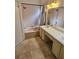 Bathroom with a pink shower/tub combo, tile floors and a vanity with sink and mirror at 1524 Crawford Dr, Apopka, FL 32703