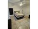 Comfortable bedroom featuring ceiling fan and tile flooring at 1524 Crawford Dr, Apopka, FL 32703