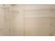 Organized closet with multiple shelves and hanging rods and ceramic tile floor at 1524 Crawford Dr, Apopka, FL 32703