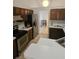 Efficient kitchen with stainless steel appliances and wood cabinets at 1524 Crawford Dr, Apopka, FL 32703