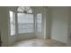 Bright, open living room with tile flooring and large windows at 1524 Crawford Dr, Apopka, FL 32703
