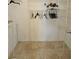 Empty walk-in closet with rod and wire rack shelving with ceramic tile floor at 1524 Crawford Dr, Apopka, FL 32703