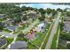 Aerial view of a desirable lakeside neighborhood pinpointing the screened-in pool, and well-maintained homes at 1546 Royal Cir, Apopka, FL 32703