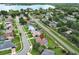 Neighborhood aerial view with water views, pinpointing a home in a community of well-kept lawns and nearby roads at 1546 Royal Cir, Apopka, FL 32703