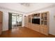 Bedroom featuring built-in cabinets, shelving, and glass door to pool area at 1546 Royal Cir, Apopka, FL 32703