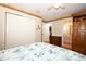 Comfortable bedroom featuring wood-look flooring, ceiling fan, and closet at 1546 Royal Cir, Apopka, FL 32703