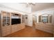 Spacious bedroom with hardwood floors, walk in closet, and views of the pool at 1546 Royal Cir, Apopka, FL 32703