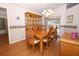 Dining room with table, chairs, and glass hutch near sliding glass door at 1546 Royal Cir, Apopka, FL 32703