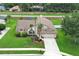 Well maintained single-Gathering home with manicured lawn and landscaping with an attached two-car garage at 1546 Royal Cir, Apopka, FL 32703