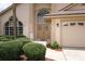 Up close view of home's entrance with arched window, double doors, and 1546 address at 1546 Royal Cir, Apopka, FL 32703