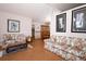 Open living area leading to dining room with wood floors and furnishings at 1546 Royal Cir, Apopka, FL 32703
