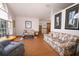 Spacious living area featuring wood floors and floral sofas at 1546 Royal Cir, Apopka, FL 32703
