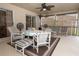 Covered outdoor patio featuring seating, ceiling fans, a rug, and access to the lawn at 1546 Royal Cir, Apopka, FL 32703