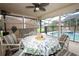 Covered patio area overlooking the pool with fans, seating and view of the yard at 1546 Royal Cir, Apopka, FL 32703
