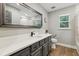 Bathroom features a large vanity with a gray cabinet, white countertop, and a vessel sink at 1795 Markham Glen Cir, Longwood, FL 32779