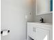 Neutral bathroom with a white vanity, black faucet, and a minimalist design at 1795 Markham Glen Cir, Longwood, FL 32779