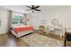 Bright bedroom featuring a large window, a playful rug, and a cozy atmosphere for restful nights at 1795 Markham Glen Cir, Longwood, FL 32779