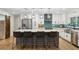 Updated kitchen with a large central island, bar seating, and white cabinetry, ideal for entertaining at 1795 Markham Glen Cir, Longwood, FL 32779