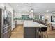 Bright kitchen with white cabinets, stainless steel appliances, and a large island with seating at 1795 Markham Glen Cir, Longwood, FL 32779