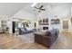 Bright living room featuring a cozy fireplace, tall ceilings, and sliding glass doors to the backyard at 1795 Markham Glen Cir, Longwood, FL 32779