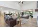 Open-concept living room and kitchen featuring natural light, neutral tones, and modern furnishings at 1795 Markham Glen Cir, Longwood, FL 32779