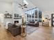 Bright living room with soaring ceilings, stunning brick fireplace, and large windows create a cozy and inviting space at 1795 Markham Glen Cir, Longwood, FL 32779