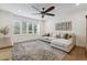 Comfortable living room featuring a ceiling fan, natural light, and cozy seating, perfect for relaxation and Gathering time at 1795 Markham Glen Cir, Longwood, FL 32779