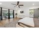 Bright main bedroom offers pool access, a sleek barn door to the bathroom, and a tranquil view of the outdoor living space at 1795 Markham Glen Cir, Longwood, FL 32779