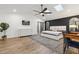 Spacious main bedroom with skylights, a dark accent wall, and a sliding barn door leading to the bathroom at 1795 Markham Glen Cir, Longwood, FL 32779