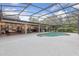 A gorgeous backyard featuring a screened-in pool and a relaxing outdoor entertaining space at 1795 Markham Glen Cir, Longwood, FL 32779