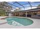 Sparkling in-ground pool with screened-in lanai, perfect for relaxation and outdoor entertaining at 1795 Markham Glen Cir, Longwood, FL 32779