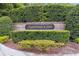 Brick sign at entrance to Markham Glen features lush landscaping and manicured hedges at 1795 Markham Glen Cir, Longwood, FL 32779