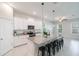 Open kitchen with stainless steel appliances, granite countertops, and adjacent breakfast area at 1997 Standing Rock Cir, Oakland, FL 34787