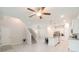 Bright living space with tiled floors, a center island kitchen, and access to the carpeted stairs at 1997 Standing Rock Cir, Oakland, FL 34787