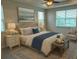 Comfortable main bedroom features a tray ceiling, ceiling fan, plush carpet, and great natural light at 1997 Standing Rock Cir, Oakland, FL 34787