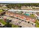 View of an apartment complex showcasing a brick facade, parking, and community amenities at 2250 S Palmetto Ave # I-11, Daytona Beach, FL 32119