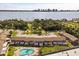 Apartment complex with well-kept landscaping, assigned parking, and a community pool with lounge seating at 2250 S Palmetto Ave # I-11, Daytona Beach, FL 32119