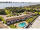 An apartment complex with water views, lush landscaping, assigned parking, and a community pool at 2250 S Palmetto Ave # I-11, Daytona Beach, FL 32119