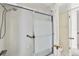 Clean bathroom shower with glass doors and a view of the toilet at 2250 S Palmetto Ave # I-11, Daytona Beach, FL 32119