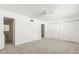 Bright bedroom features neutral carpet, ceiling fan, and closet doors at 2250 S Palmetto Ave # I-11, Daytona Beach, FL 32119