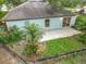 Aerial view of the backyard with patio, landscaping, and room to enjoy the outdoors at 2353 Kingscrest Cir, Apopka, FL 32712