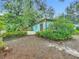 Private backyard featuring a patio and lush landscaping at 2353 Kingscrest Cir, Apopka, FL 32712