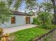 Backyard with patio area and tropical foliage and plantings at 2353 Kingscrest Cir, Apopka, FL 32712