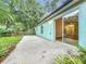 A patio in a backyard, perfect for entertaining or relaxing outdoors with lots of vegetation at 2353 Kingscrest Cir, Apopka, FL 32712