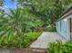Backyard featuring a patio and lush landscaping at 2353 Kingscrest Cir, Apopka, FL 32712