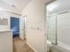 Hallway leading to bathroom featuring a shower and neutral-colored walls at 2353 Kingscrest Cir, Apopka, FL 32712