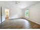 Spacious bedroom with a ceiling fan and lots of natural light from the windows at 2353 Kingscrest Cir, Apopka, FL 32712