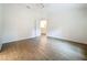 Bright, airy bedroom featuring light wood-look flooring, neutral walls, and a ceiling fan at 2353 Kingscrest Cir, Apopka, FL 32712