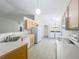 The kitchen boasts stainless appliances and leads to the laundry, eating and living areas at 2353 Kingscrest Cir, Apopka, FL 32712